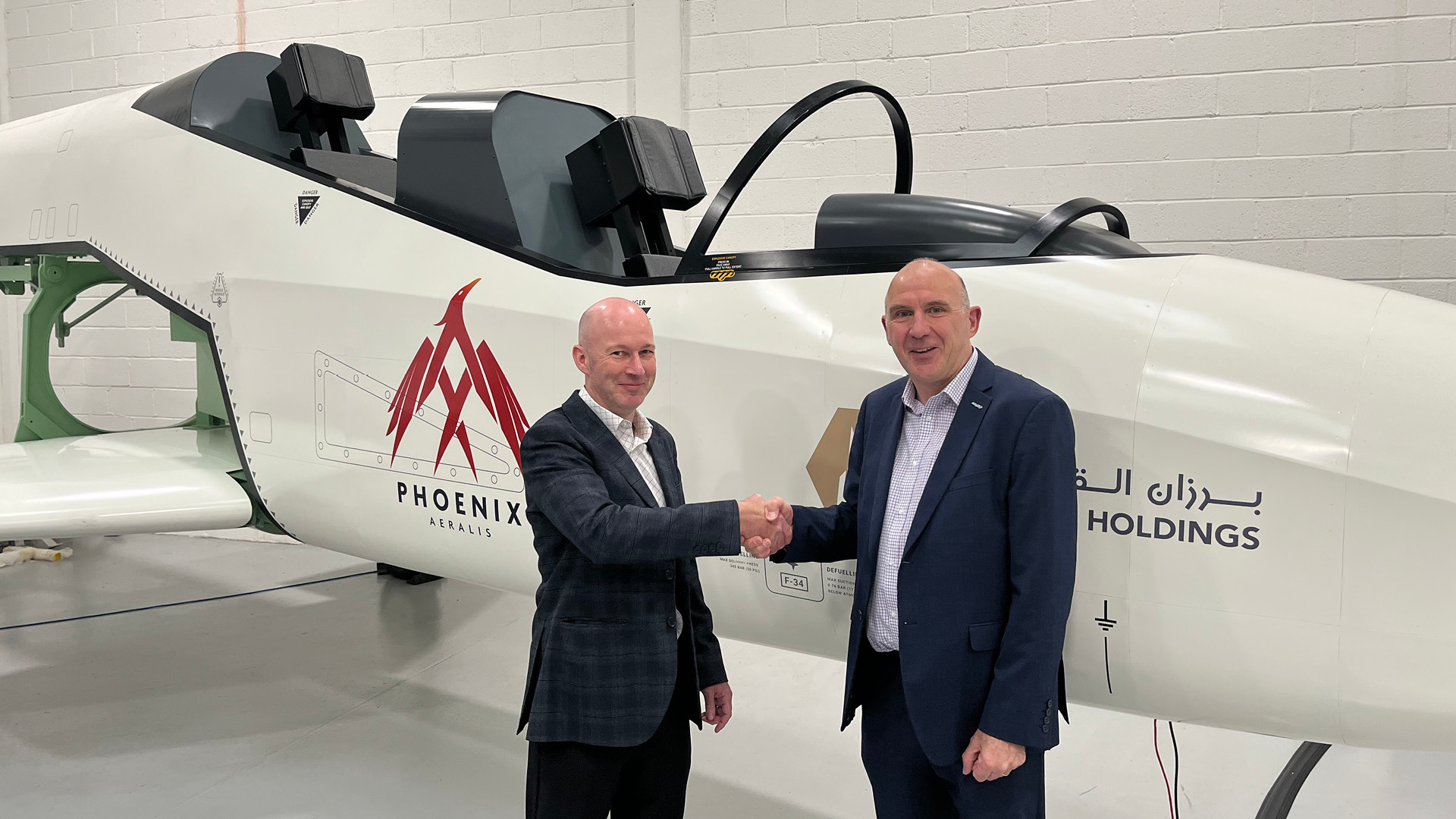 Mark Williams of AERALIS and Nigel Yard, Head of Defence Division at Aerogility, mark the agreement alongside the AERALIS Phoenix engineering demonstrator.