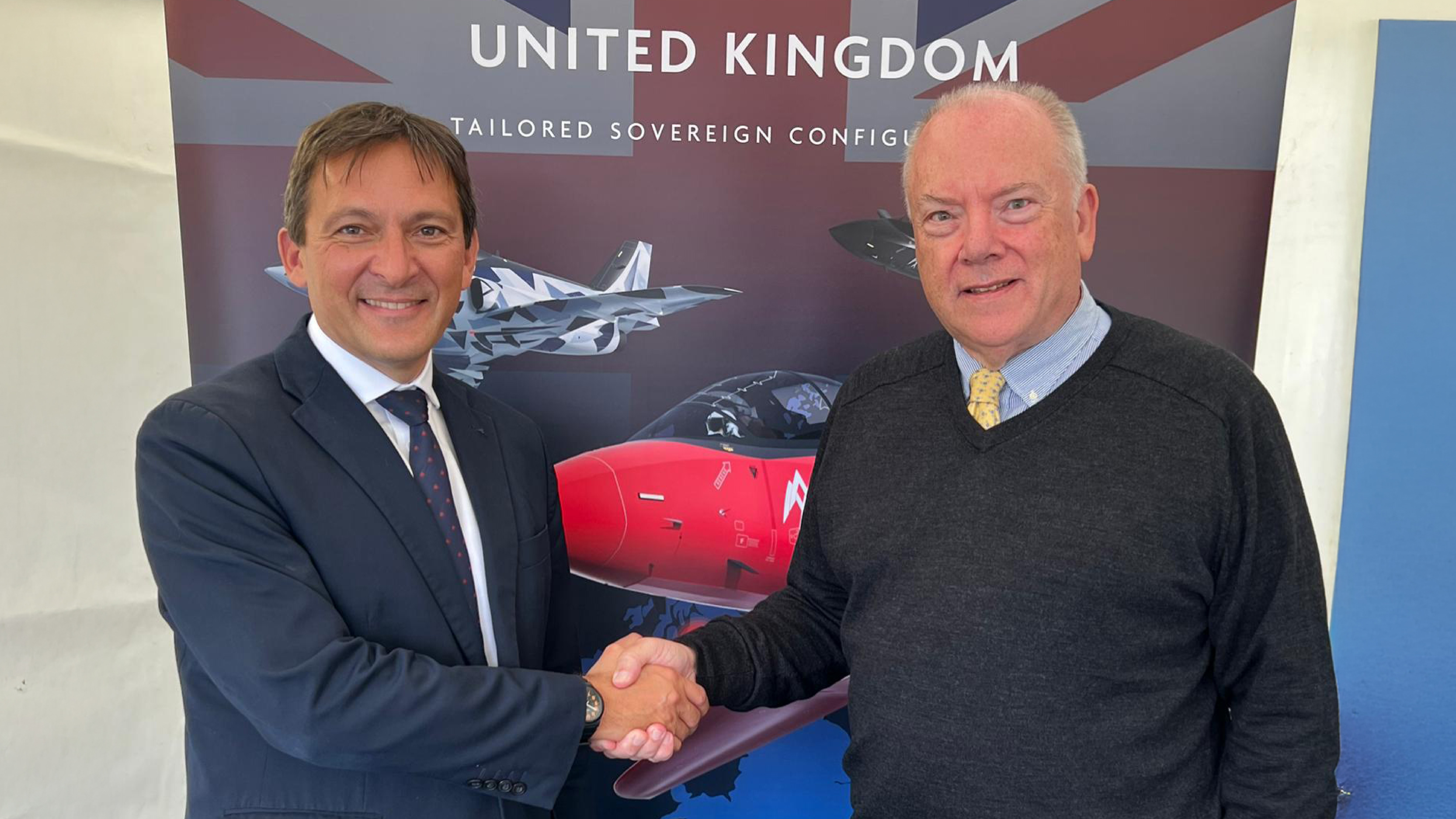 Tristan Crawford, CEO of AERALIS and Ian Forgie, CEO of Prestwick Airport, shake hands to make the signing of a new strategic agreement.